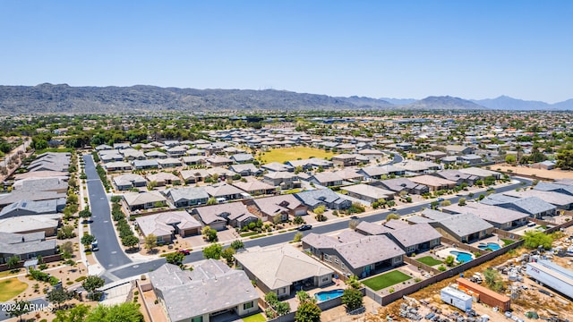 birds eye view of property featuring a mountain view