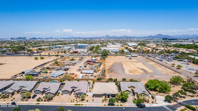 birds eye view of property with a mountain view