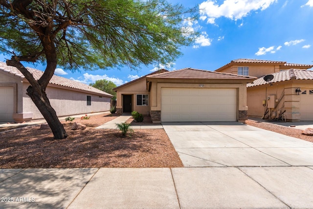 11139 W Devonshire Ave, Phoenix, AZ 85037 - view of front facade featuring an attached garage, stucco siding, driveway, and stone siding