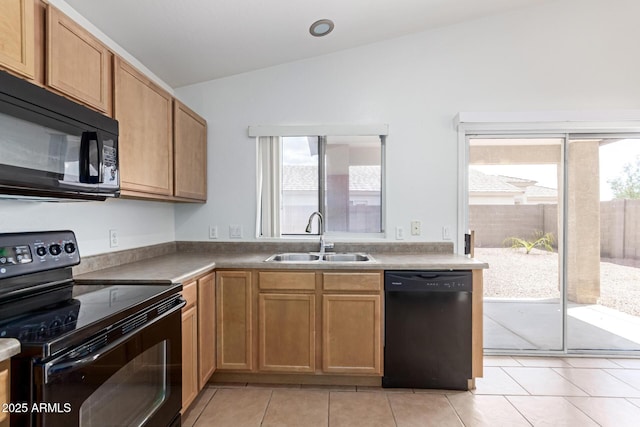 11139 W Devonshire Ave, Phoenix, AZ 85037 - kitchen featuring black appliances, a sink, lofted ceiling, and light tile patterned flooring