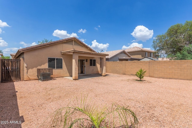 11139 W Devonshire Ave, Phoenix, AZ 85037 - rear view of house with stucco siding, a fenced backyard, a tiled roof, and a patio