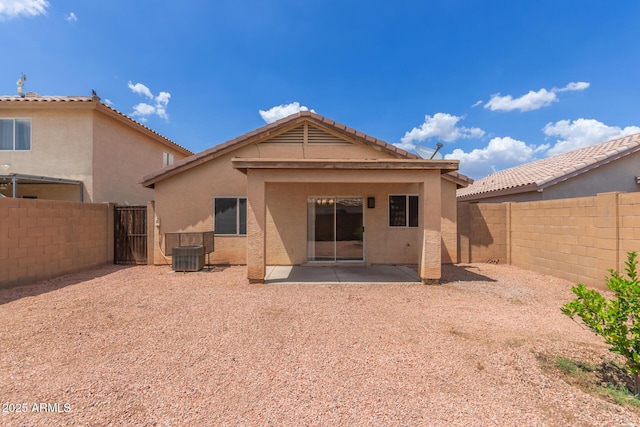 11139 W Devonshire Ave, Phoenix, AZ 85037 - back of house featuring a fenced backyard, stucco siding, a patio, and central AC