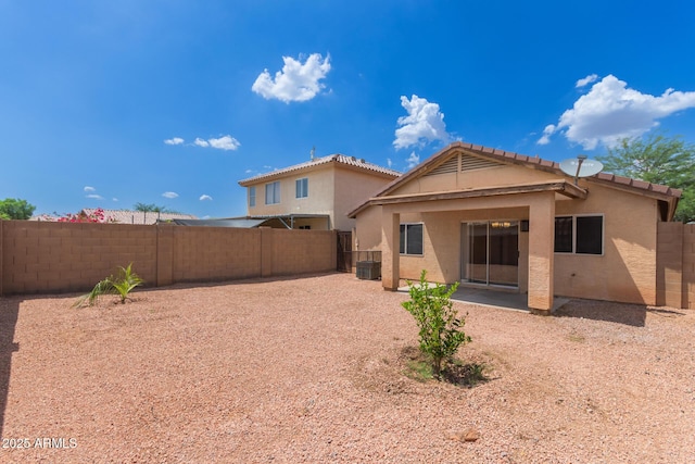 11139 W Devonshire Ave, Phoenix, AZ 85037 - rear view of property with stucco siding, a fenced backyard, a tiled roof, and a patio area