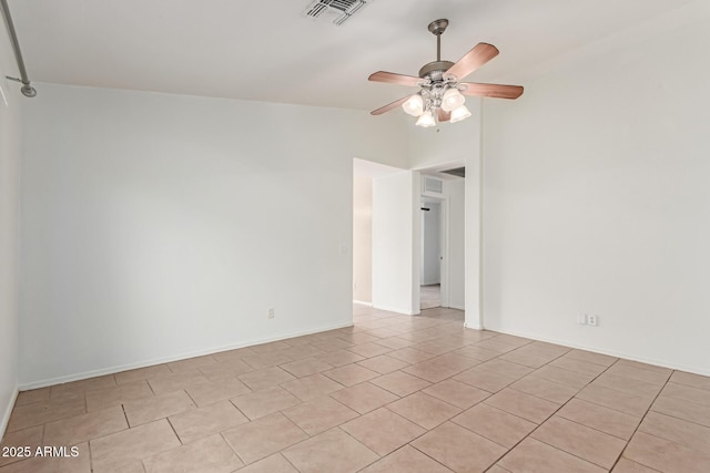 11139 W Devonshire Ave, Phoenix, AZ 85037 - empty room featuring vaulted ceiling, ceiling fan, and light tile patterned floors