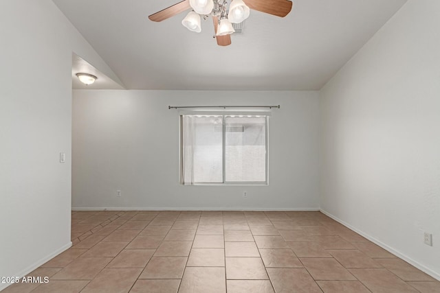 11139 W Devonshire Ave, Phoenix, AZ 85037 - spare room with a ceiling fan, light tile patterned floors, baseboards, and vaulted ceiling