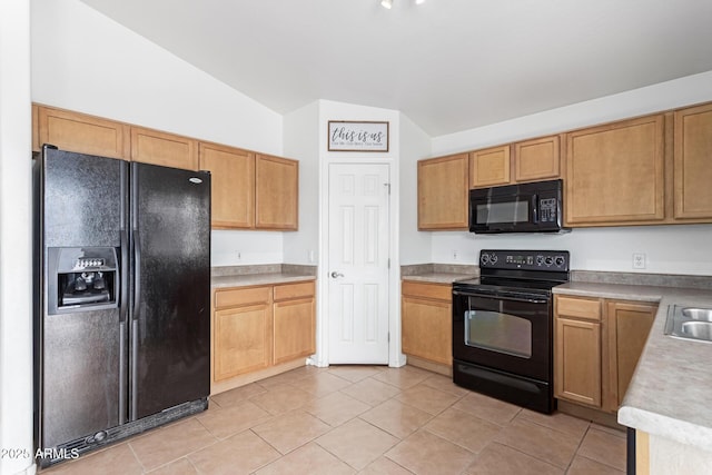 11139 W Devonshire Ave, Phoenix, AZ 85037 - kitchen with black appliances, vaulted ceiling, light tile patterned floors, light countertops, and a sink
