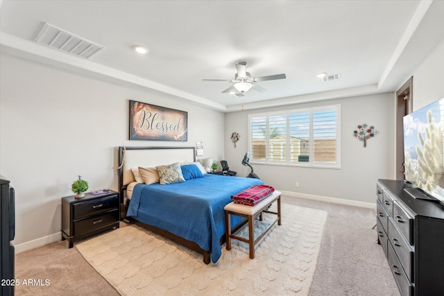 bedroom with visible vents, light colored carpet, and baseboards