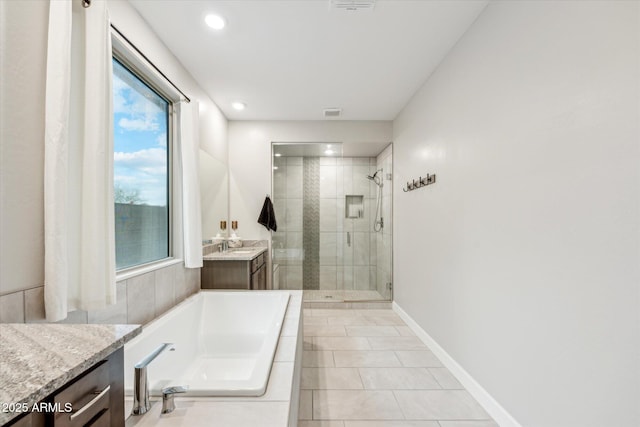 full bathroom featuring baseboards, a garden tub, recessed lighting, a stall shower, and vanity