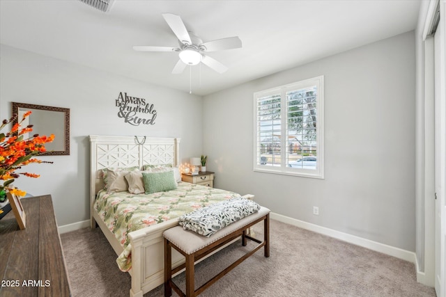 bedroom featuring visible vents, baseboards, light colored carpet, and a ceiling fan