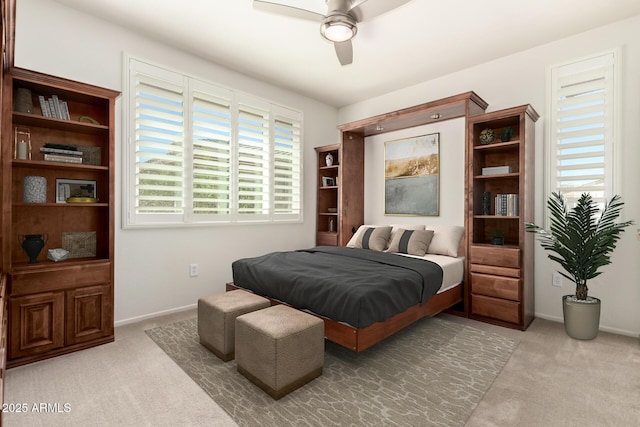 bedroom featuring carpet, a ceiling fan, and baseboards