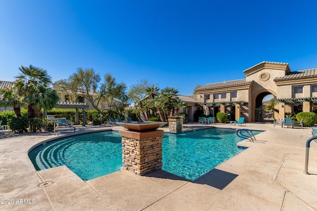 pool featuring a pergola and a patio