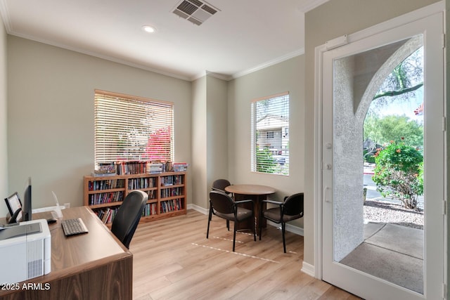 office with recessed lighting, visible vents, ornamental molding, light wood-type flooring, and baseboards