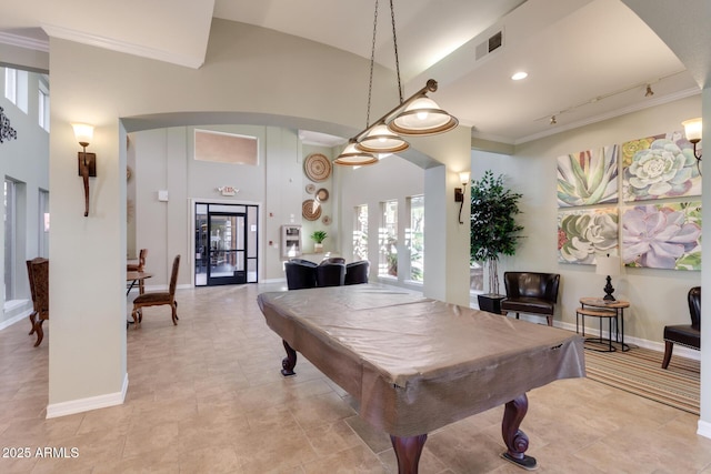 recreation room featuring high vaulted ceiling, baseboards, visible vents, and arched walkways