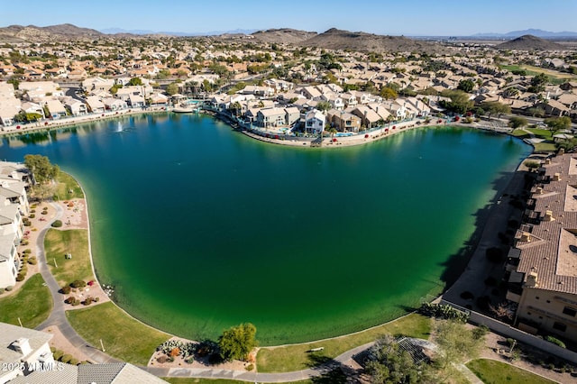 drone / aerial view with a residential view and a water and mountain view