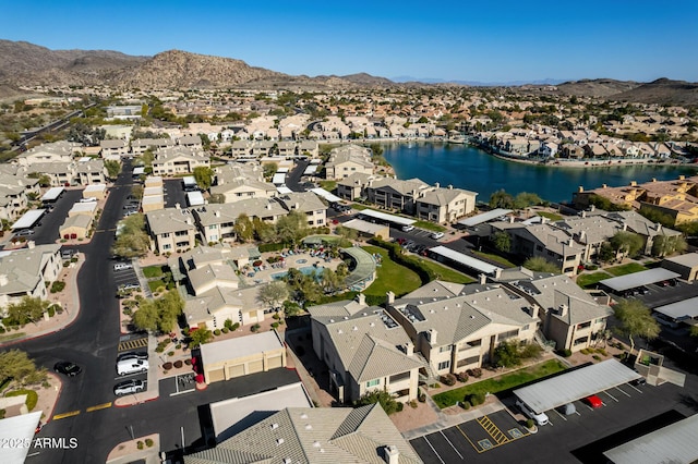 birds eye view of property with a residential view and a water and mountain view