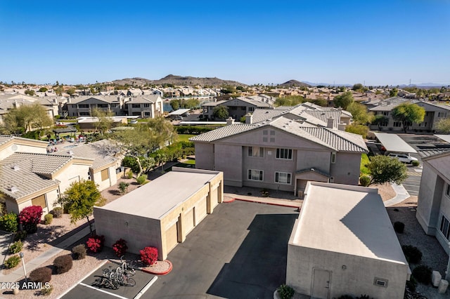 drone / aerial view with a residential view and a mountain view