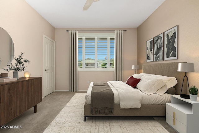 bedroom featuring light carpet, ceiling fan, and baseboards