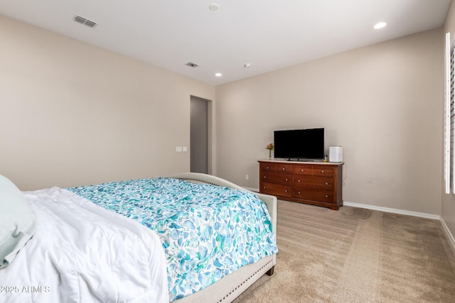 bedroom with light colored carpet, baseboards, and recessed lighting