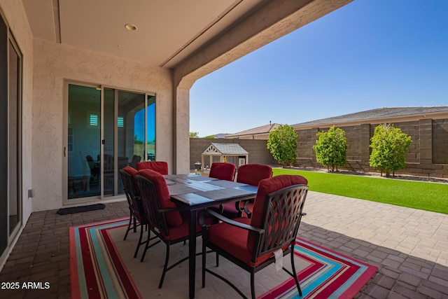 view of patio featuring a fenced backyard and outdoor dining space