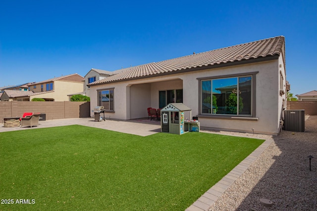 back of property with central air condition unit, a patio area, stucco siding, and a tiled roof