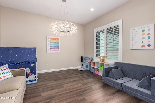 living room with a chandelier, wood finished floors, baseboards, and recessed lighting