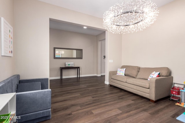 living room featuring wood finished floors, a chandelier, baseboards, and recessed lighting