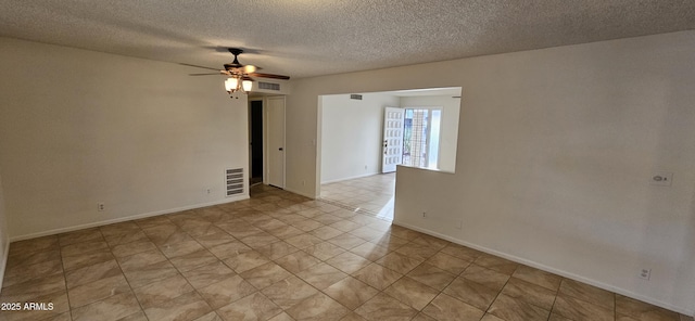 spare room with ceiling fan and a textured ceiling