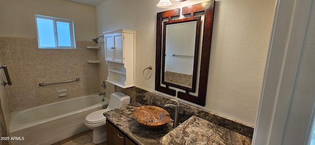 full bathroom with tiled shower / bath, vanity, and toilet