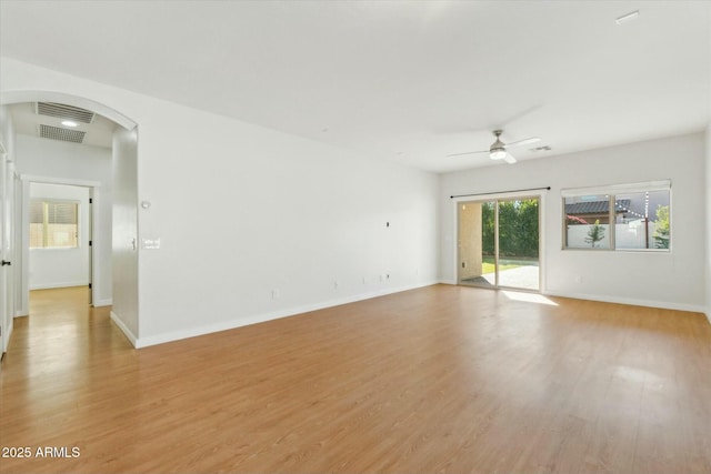 empty room with light hardwood / wood-style flooring and ceiling fan