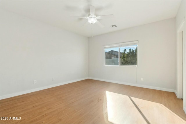 unfurnished room with light hardwood / wood-style floors and ceiling fan