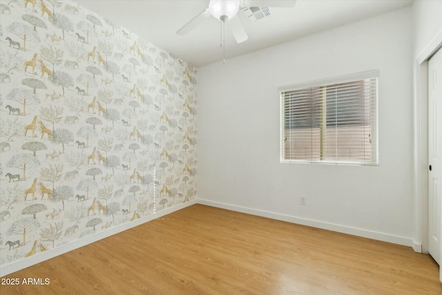 unfurnished room with light hardwood / wood-style floors and ceiling fan