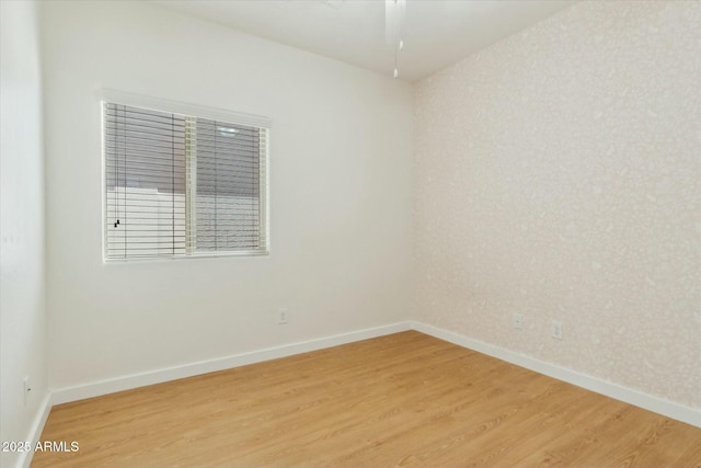 spare room featuring light wood-type flooring