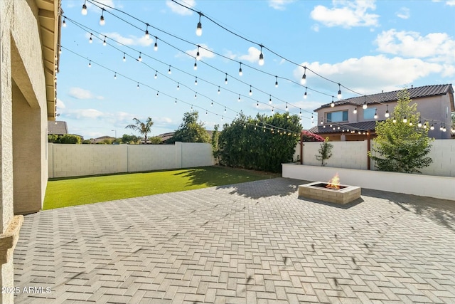 view of patio with an outdoor fire pit