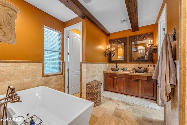 bathroom featuring beamed ceiling, tile walls, vanity, and a bathing tub