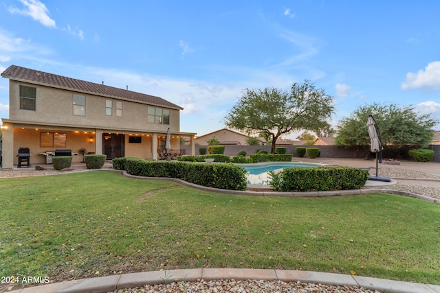 exterior space featuring a lawn and a patio area