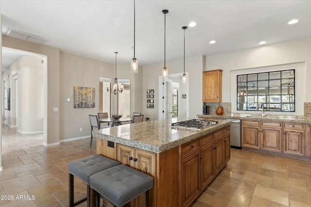 kitchen featuring stone tile floors, visible vents, a healthy amount of sunlight, and appliances with stainless steel finishes