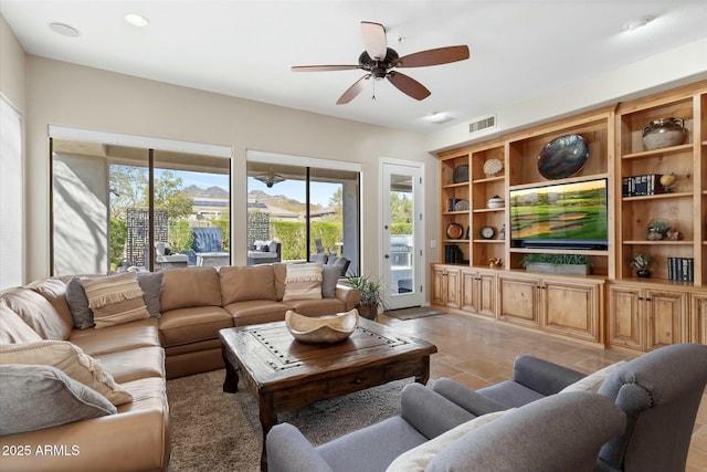 living room featuring light tile patterned floors, visible vents, recessed lighting, and a ceiling fan