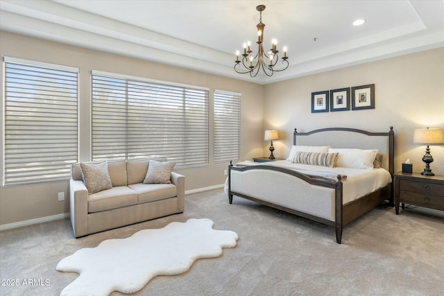 carpeted bedroom featuring a chandelier, recessed lighting, a tray ceiling, and baseboards