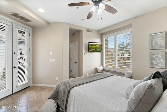 bedroom featuring visible vents, access to outside, stone tile flooring, and french doors