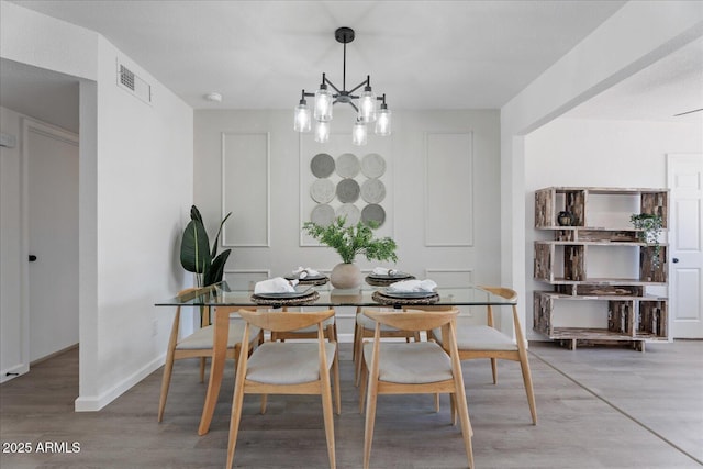 1561 N Sterling St, Mesa, AZ 85207 - dining room with wood finished floors and a chandelier