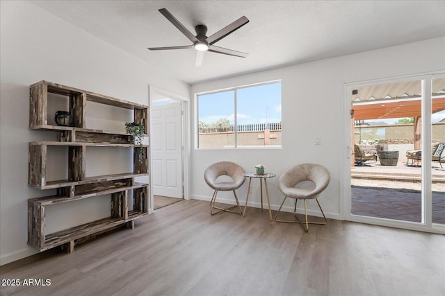 1561 N Sterling St, Mesa, AZ 85207 - sitting room with wood finished floors, healthy amount of natural light, and a ceiling fan