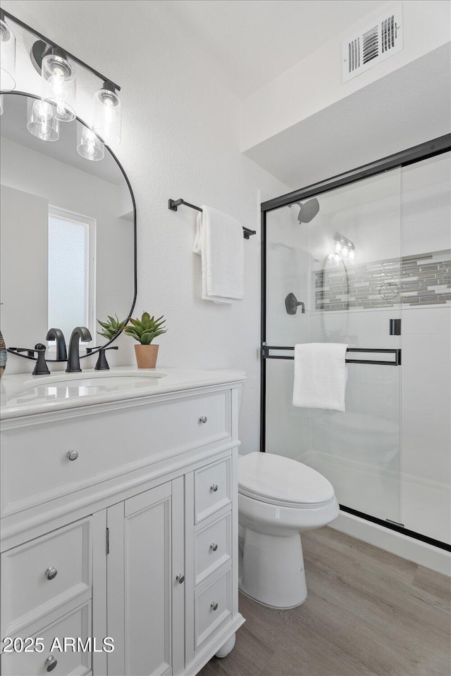 1561 N Sterling St, Mesa, AZ 85207 - bathroom with vanity, a stall shower, and wood finished floors