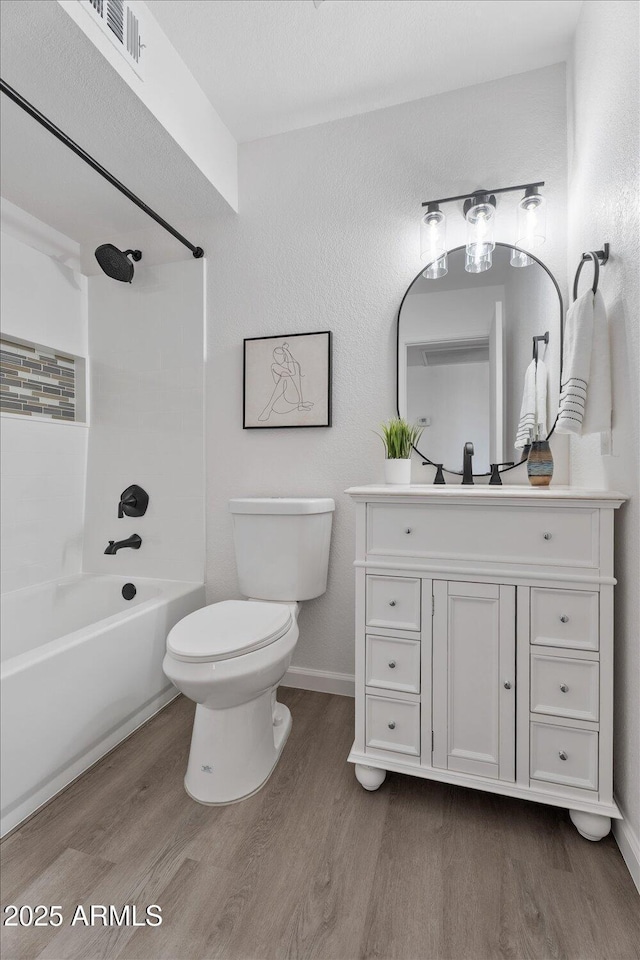 1561 N Sterling St, Mesa, AZ 85207 - bathroom with wood finished floors, vanity, and washtub / shower combination