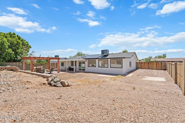 1561 N Sterling St, Mesa, AZ 85207 - rear view of property with roof mounted solar panels, a fenced backyard, a patio area, and stucco siding
