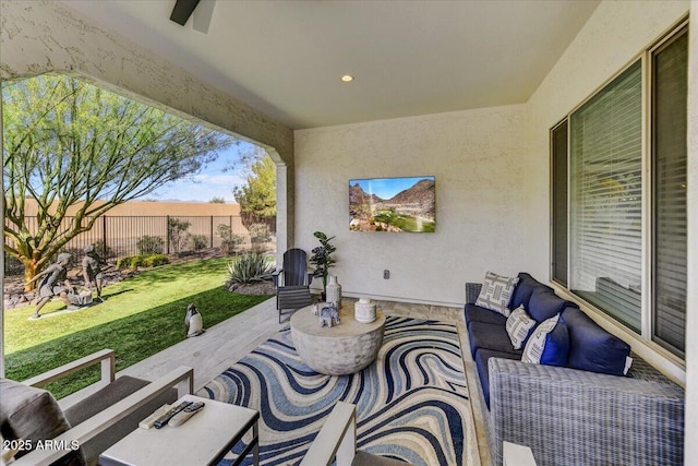 view of patio / terrace featuring outdoor lounge area and fence