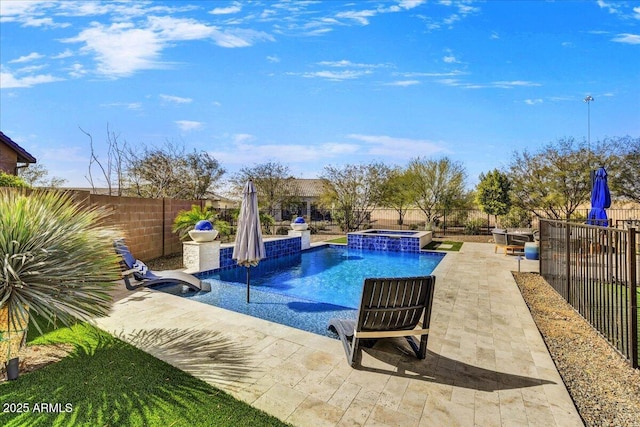 view of pool featuring a patio, a pool with connected hot tub, and a fenced backyard