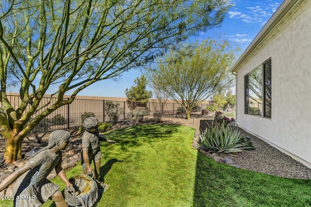 view of yard with a fenced backyard