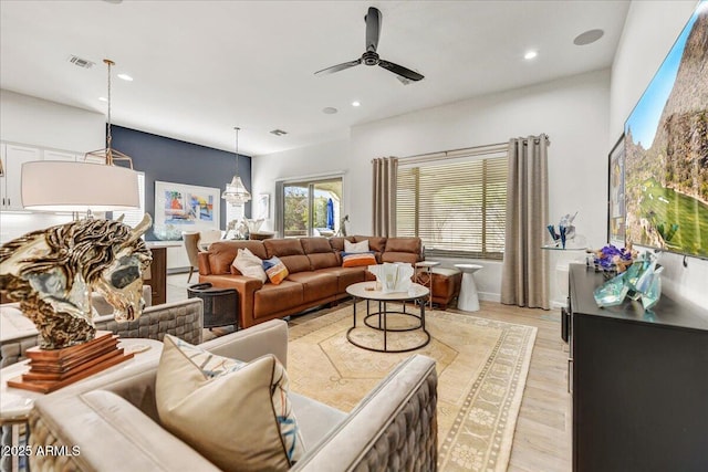 living area with visible vents, recessed lighting, light wood-type flooring, and ceiling fan