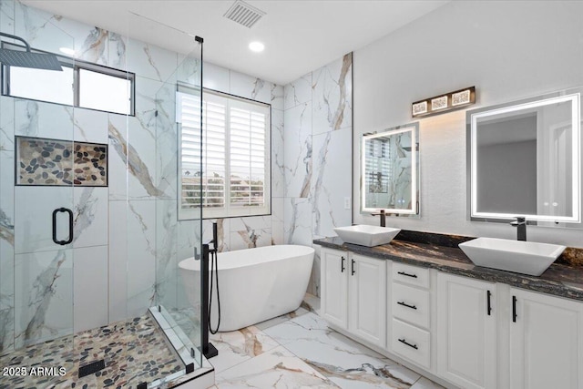 bathroom featuring vanity and shower with separate bathtub