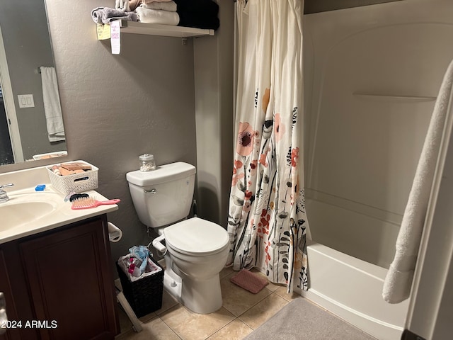 full bathroom featuring shower / tub combo, vanity, toilet, and tile patterned flooring